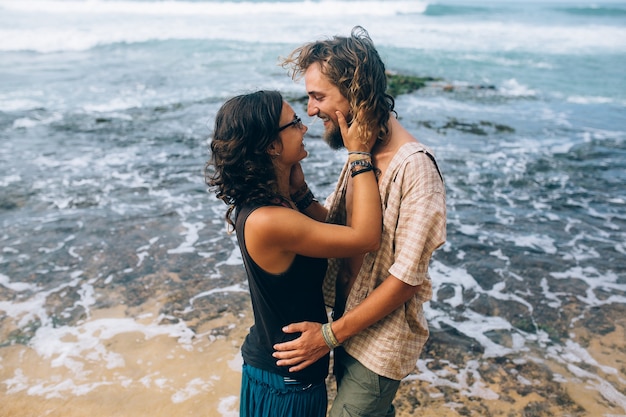 Embracing couple at ocean