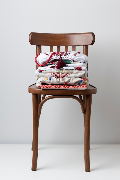 Free Photo embroidered shirts on chair assortment