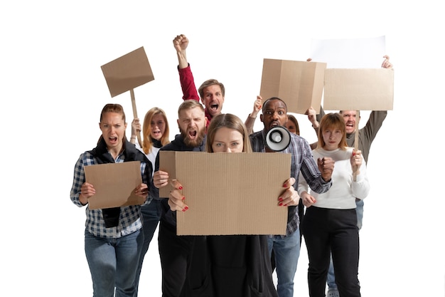 Emotional multicultural group of people screaming while holding blank placards on white