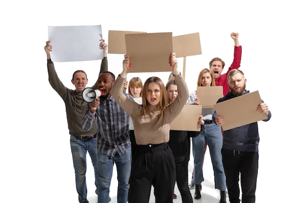 Emotional multicultural group of people screaming while holding blank placards on white