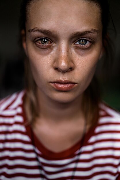 Emotional portrait of abused, crying, beautiful, young ,caucasian woman in underwear - violence concept