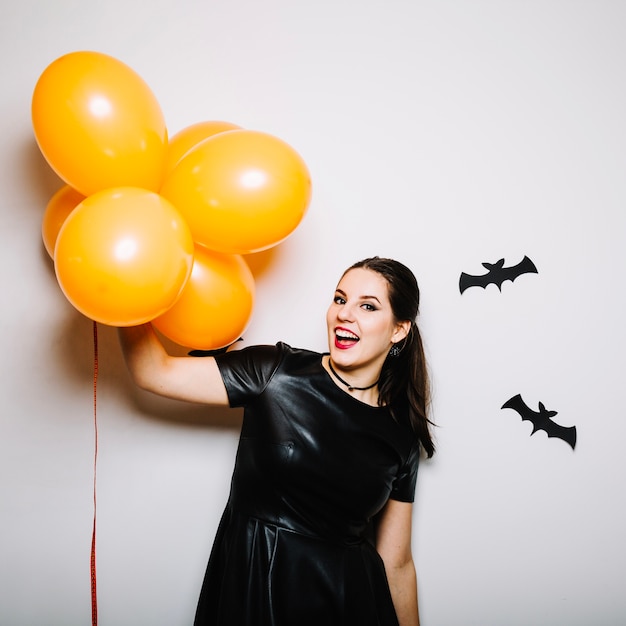 Emotional woman with balloons for Halloween