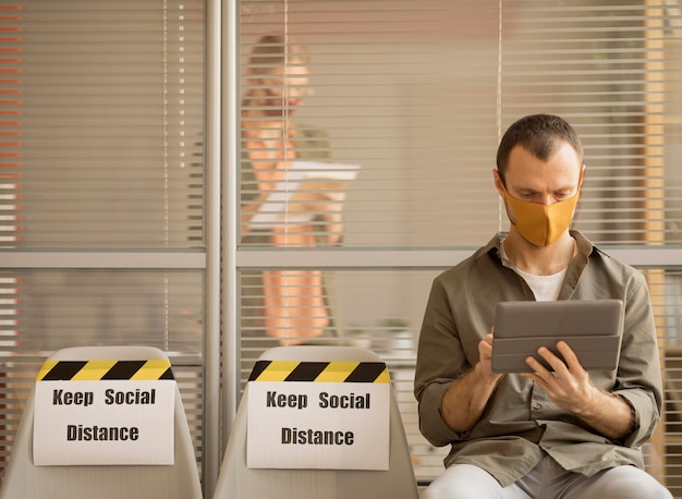 Employee wearing face mask taking a break