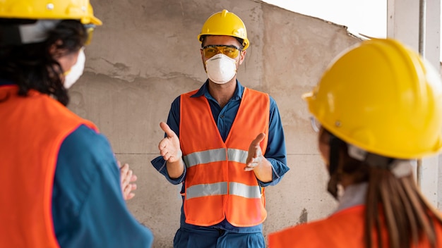 Free photo employees with safety equipment