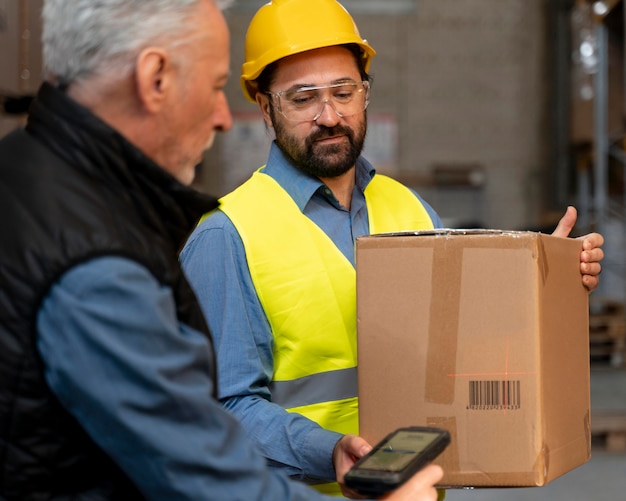 Free Photo employees working in warehouse