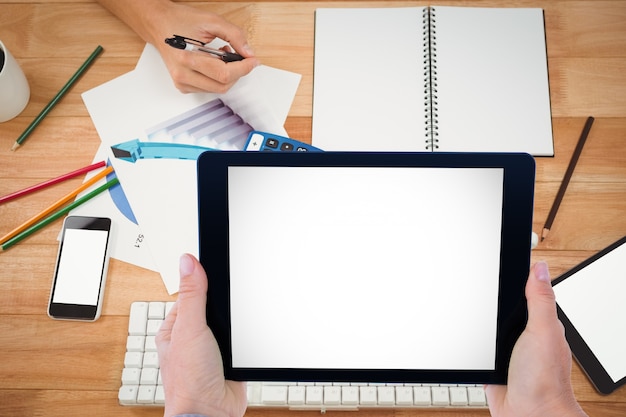 Employees working with a tablet and a notebook