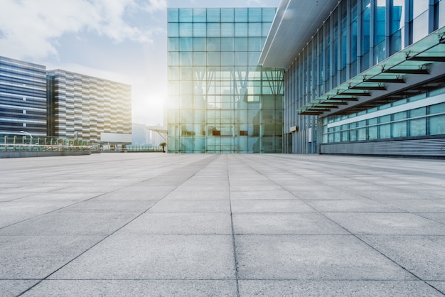 empty brick floor with modern building in background