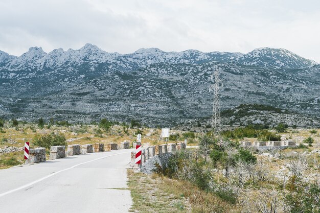 Empty curved road to Mali Halan, Southern Velebit, winding trough rocky mountains