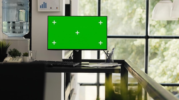 Free photo empty desk with greenscreen layout