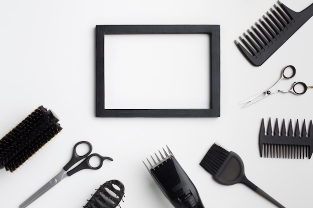 Free photo empty frame with hair supplies