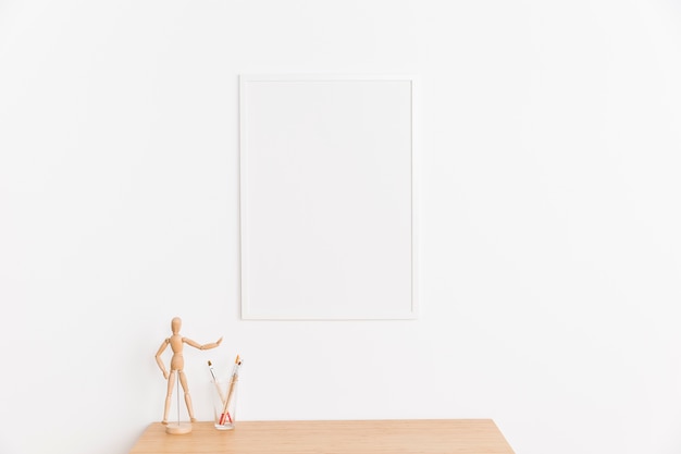 Free photo empty frame with table and figure