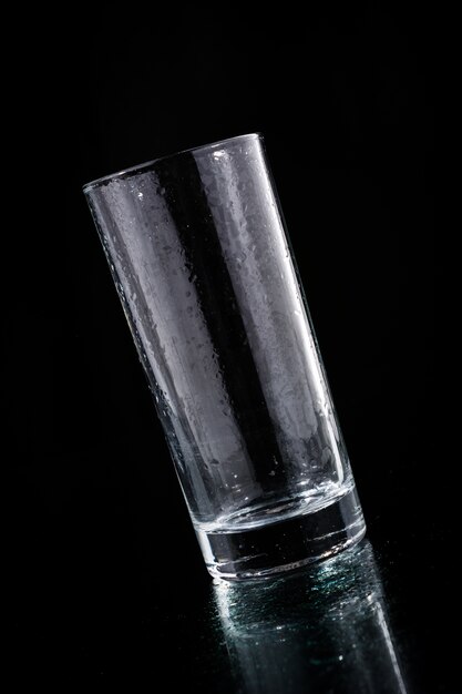 Empty glass on black background