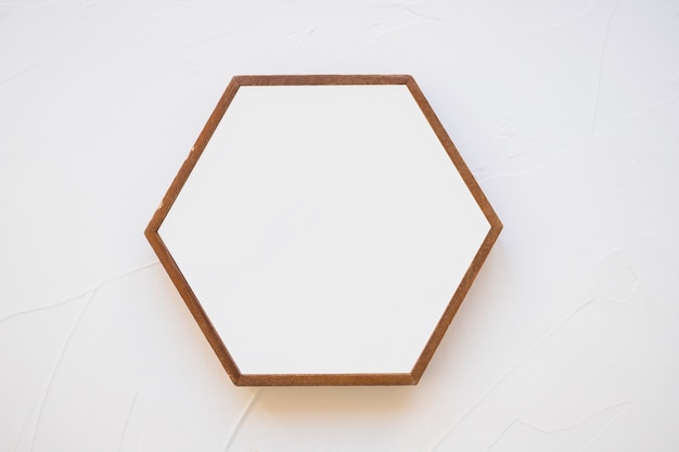 Free photo an empty hexagon frame against white background