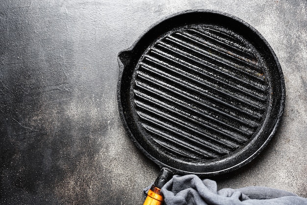 Empty iron grill pan on table