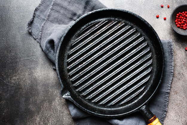 Empty iron grill pan on table