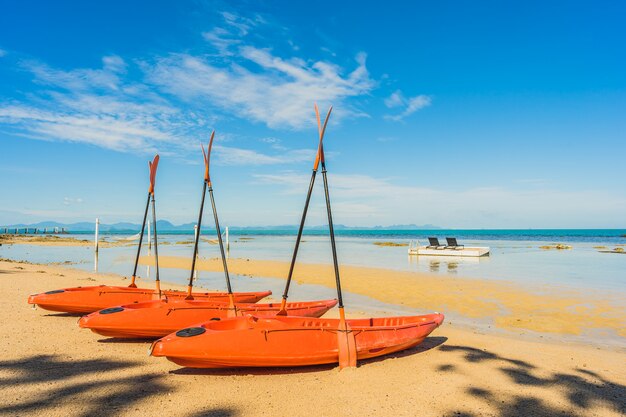 Empty kayak boat or ship on the tropical beach and sea