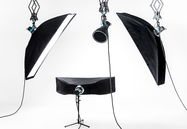 Empty photo studio with lighting equipment