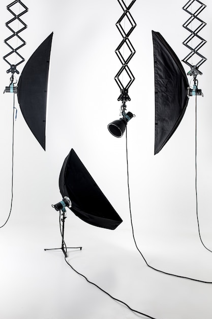 Empty photo studio with lighting equipment