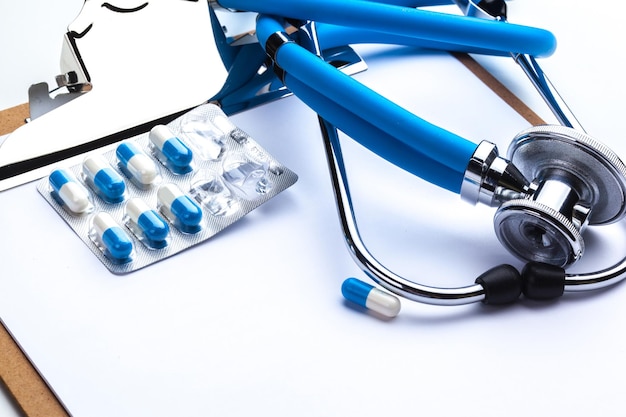 Empty prescription lying on table with stethoscope