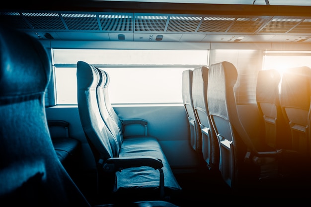 Free photo empty seats by window in train