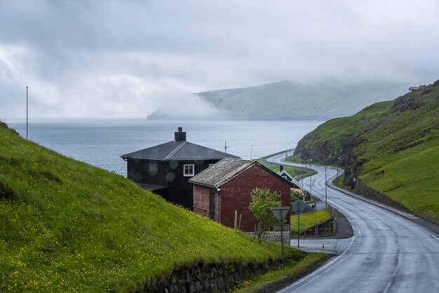 Empty street connecting two islands and a foggy sky