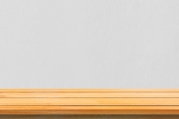 Free photo empty top wooden shelves and stone wall background. perspective brown wood shelves over stone wall background. - can be used for display or montage your products.mock up for display of product.