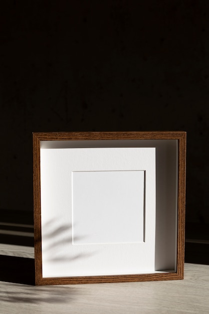 Free photo empty wooden frame high angle