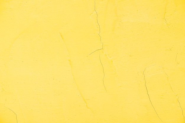 Free photo empty yellow painted textured wall