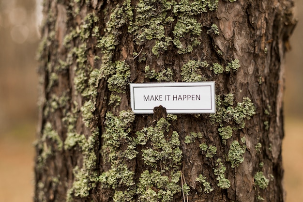 Free photo encouraging writing on tree