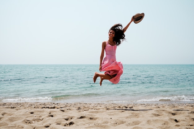 Energetic woman on the beach