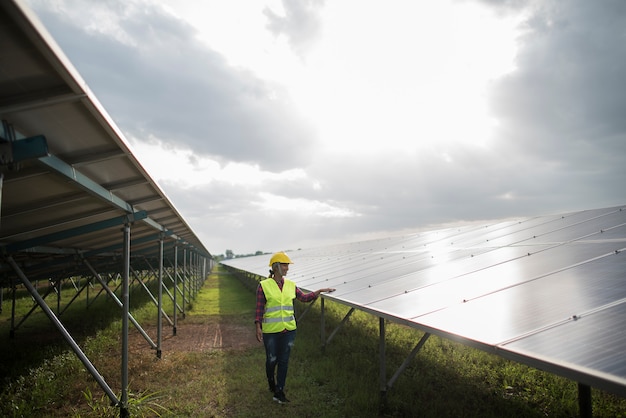 Free photo engineer electric woman checking and maintenance of solar cells.