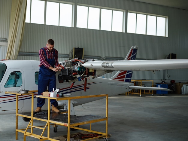 Free Photo  engineer working with a airplane