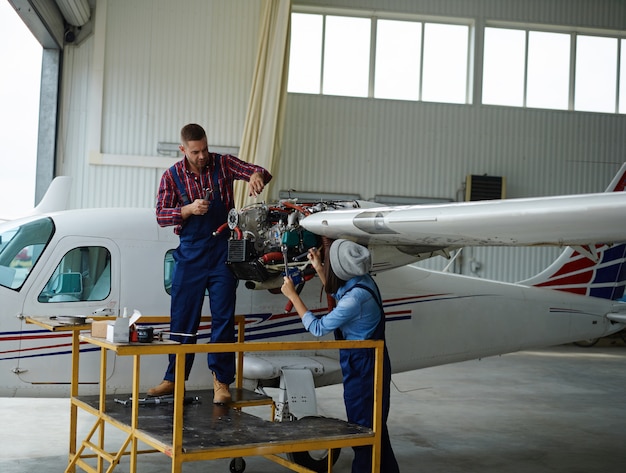 Free Photo  engineer working with a airplane