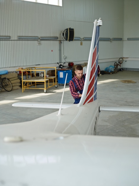 Free photo engineer working with a airplane