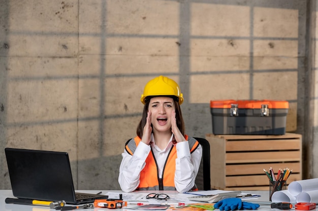 Free Photo engineer young cute smart brunette girl civil worker in helmet and vest yelling