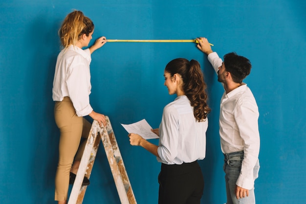 Engineers checking wall