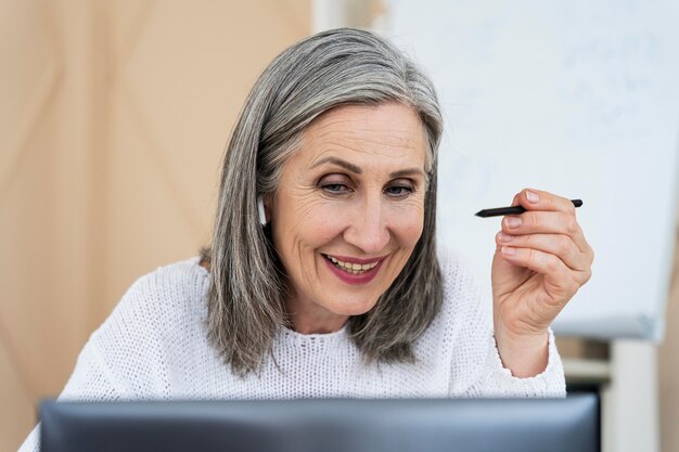 English teacher doing her class on the laptop