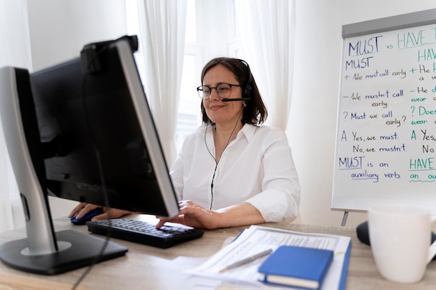 English teacher doing her class with a whiteboard