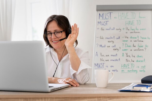 English teacher doing her lessons online at home