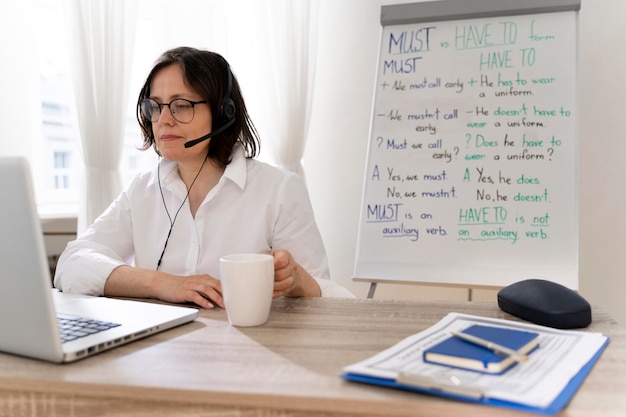 English teacher doing her lessons online at home