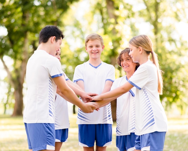 Enthusiast kids getting ready to play football