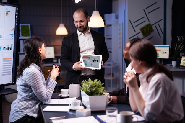 Entrepreneur businessman showing company strategy using tablet for corporate presentation