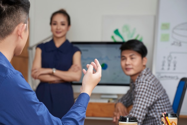 Entrepreneur talking to coworkers