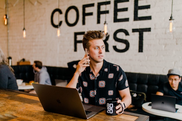 Entrepreneur working with his laptop at cafe 