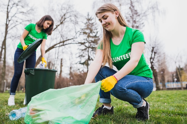 Free Photo environment and volunteer concept with two women