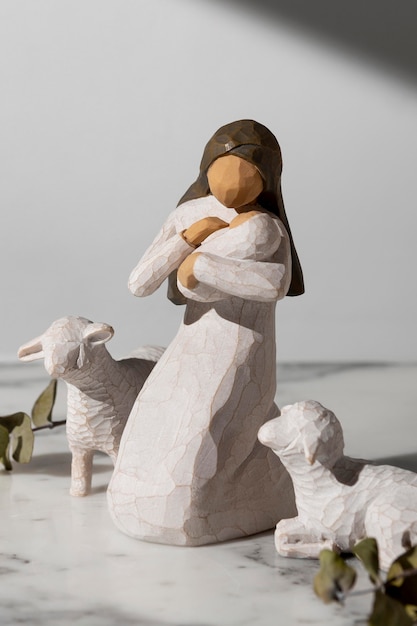 Epiphany day female figurine with newborn and sheep