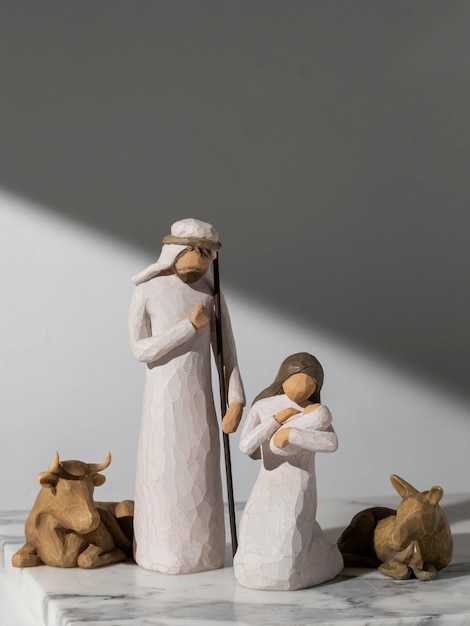 Free photo epiphany day female and male figurine with newborn and cattle