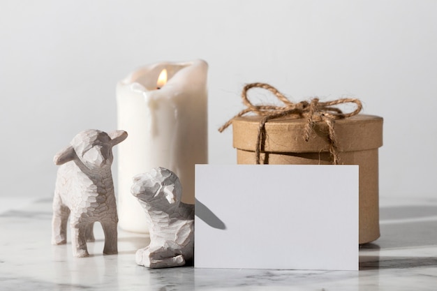 Free photo epiphany day sheep figurines with gift box and candle