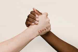 Free photo equal word on two hands joining together