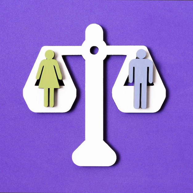 Free photo equality between man and woman on pair of scales